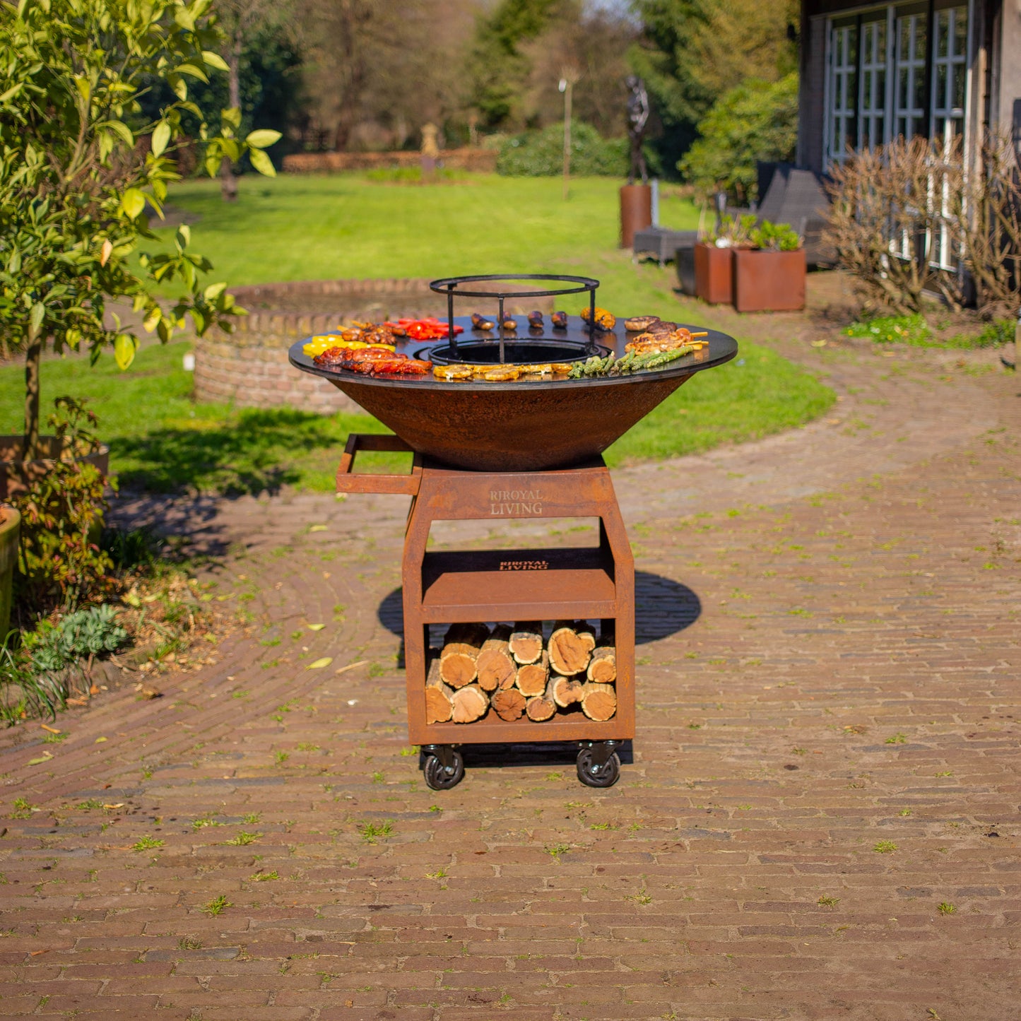BBQ Plancha Grill Maestro XXXL Ø100cm Acier Corten - Avec grandes roues et rangement pour le bois