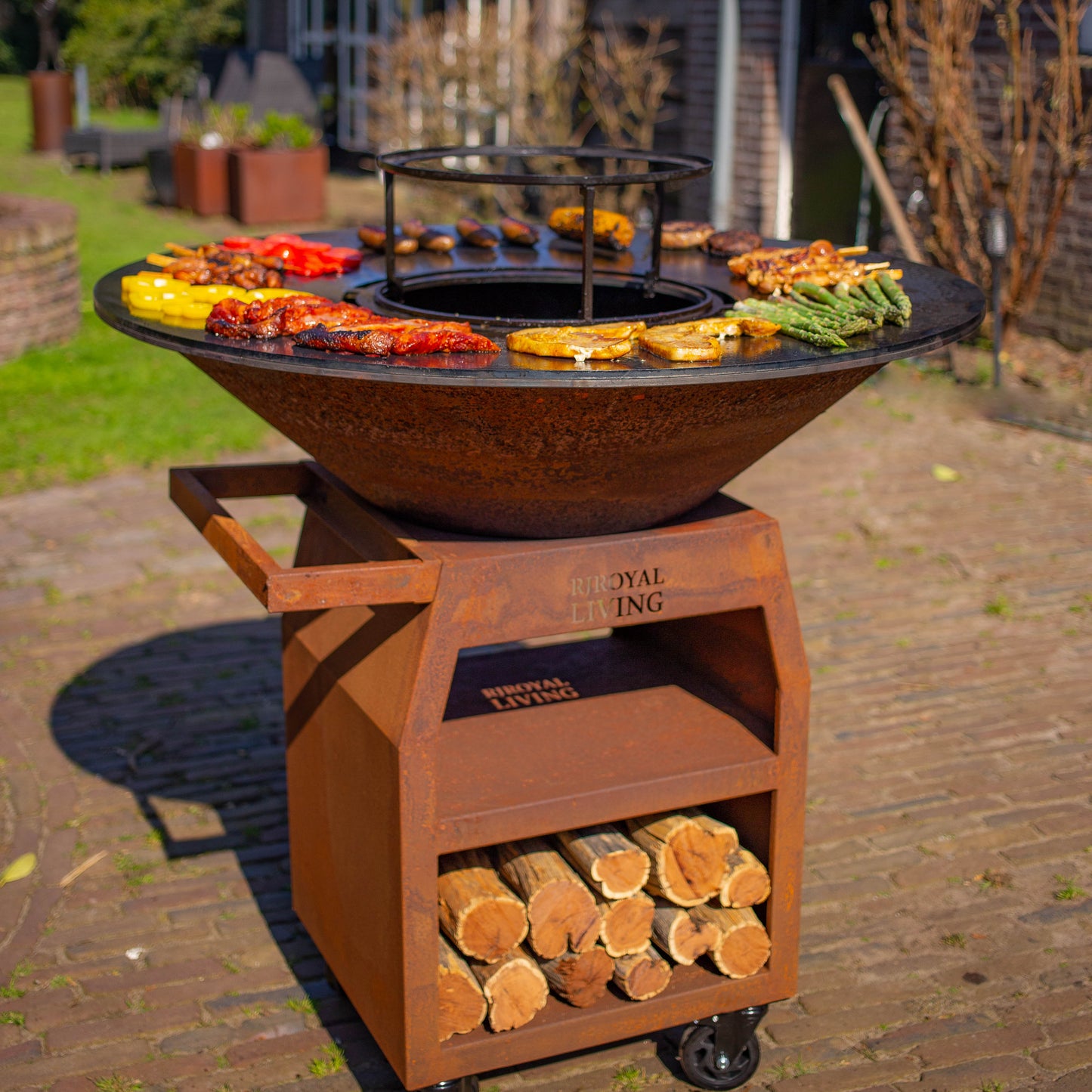 BBQ Plancha Grill Maestro XXXL Ø100cm Acier Corten - Avec grandes roues et rangement pour le bois