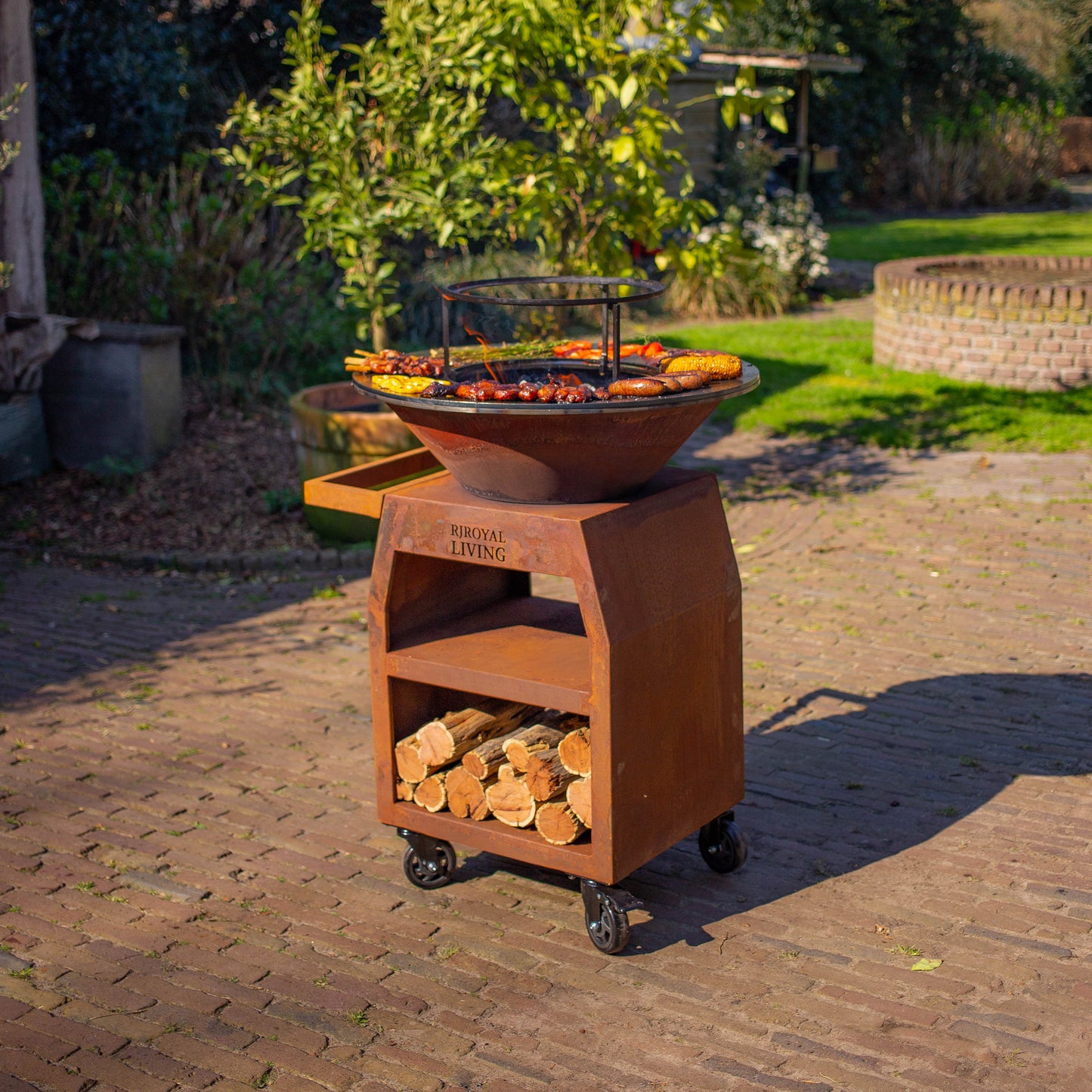 BBQ Plancha Grill Maestro Ø70cm Acier Corten - Avec grandes roues et compartiment à bois