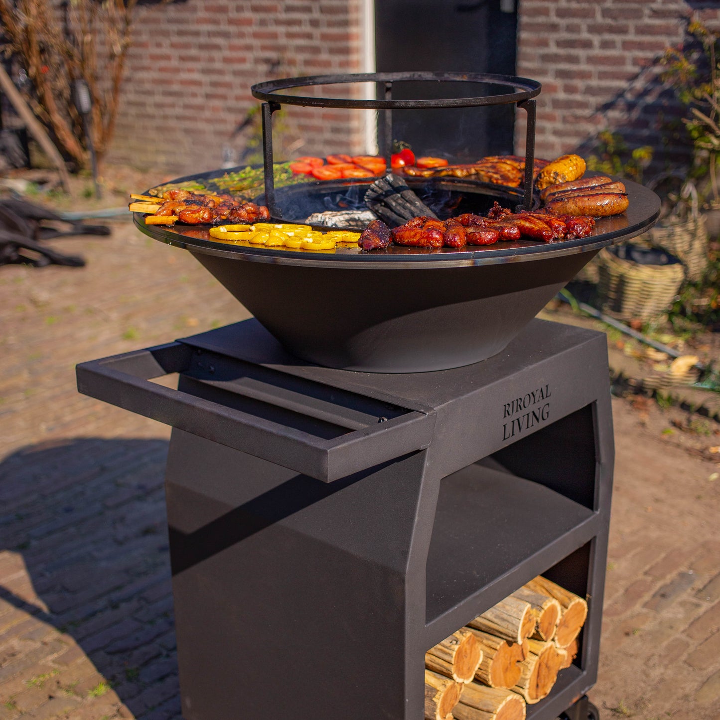 BBQ Plancha Grill Maestro Ø70cm Blackline - Avec grandes roues et compartiment à bois